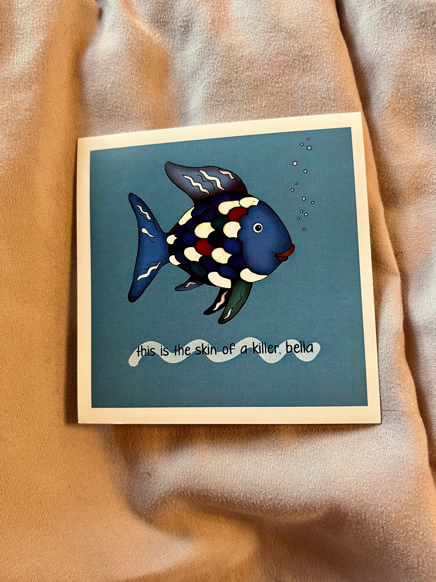“This Is the Skin of a Killer Bella” Rainbow Fish Sticker – Darkly Funny Vinyl Decal